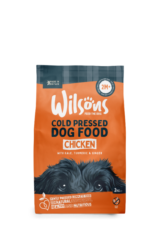 Packaging of Wilsons Cold Pressed Dog Food with an image of a dog and awards badges.