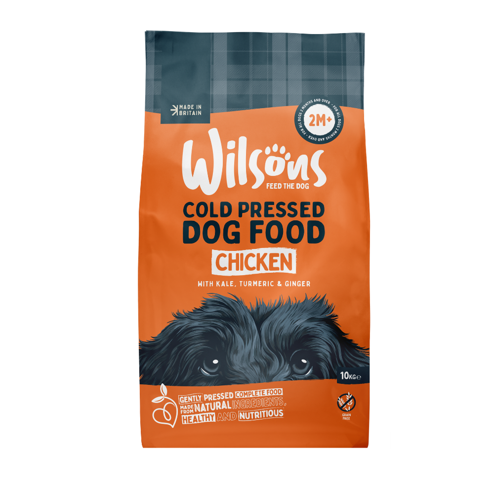 Bag of Wilsons Cold Pressed Dog Food with chicken flavor on an orange background