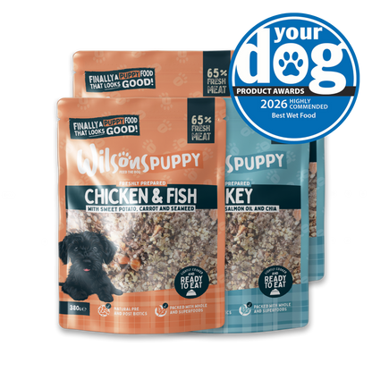 Two packages of Wilson's Puppy food with a 'Your Dog' award badge on a white background