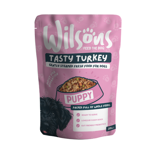 Pink package of Wilsons Tasty Turkey Puppy fresh dog food 