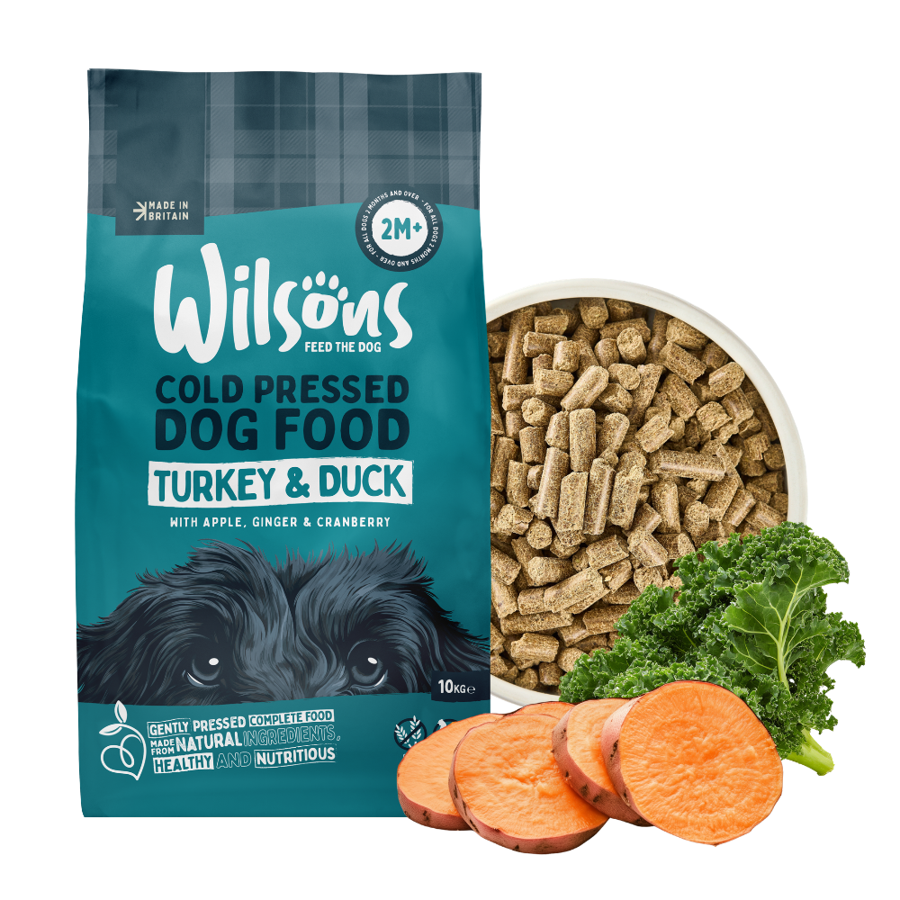 Wilson's cold pressed dog food package with ingredients on a white background